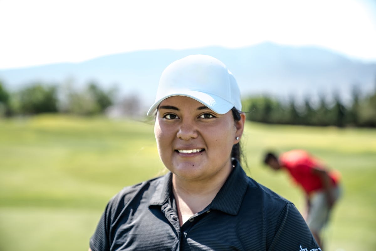 Golf ball sitting in a sand bunker trap