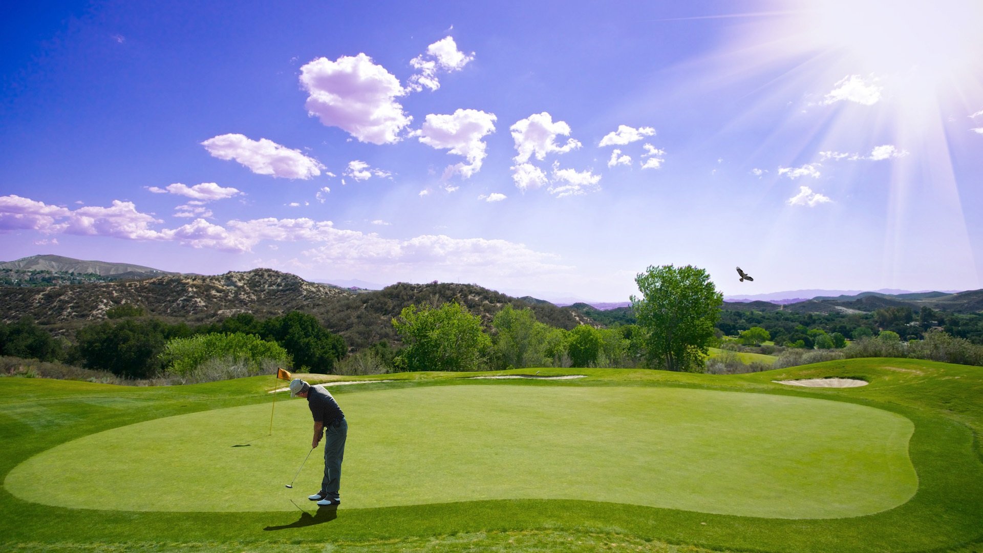 Golfer on the green during golden hour